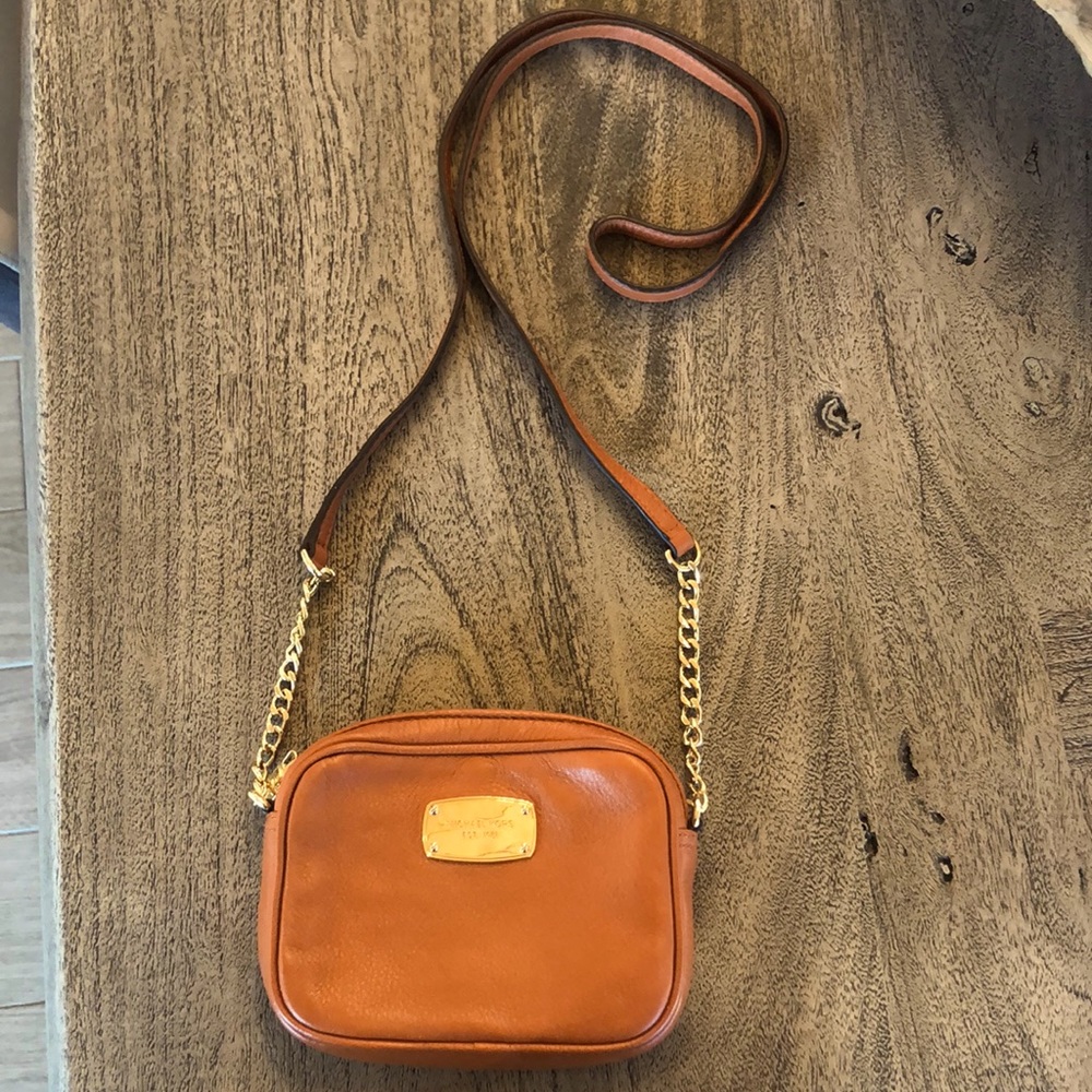 Michael Kors Genuine Leather cross body purse.  Rich saddle color